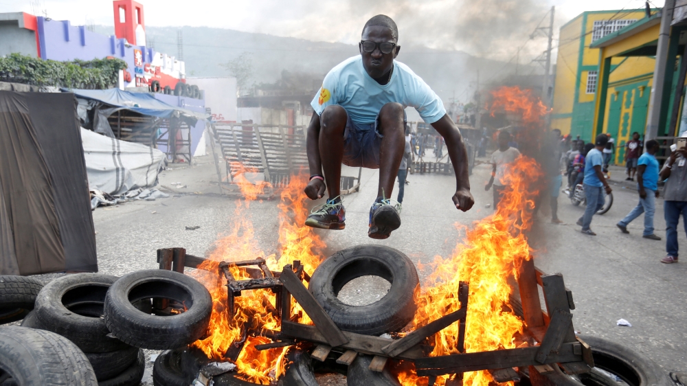 At least seven people have been killed in protests against the Haitian government this month [Jeanty Junior Augustin/Reuters]