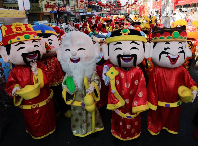 Performers wearing imperial costumes parade during Chinese Lunar New Year or Spring Festival celebration at Chinatown in Yangon, Myanmar, 05 February 2019. The Chinese New Year, the Year of the Pig, b