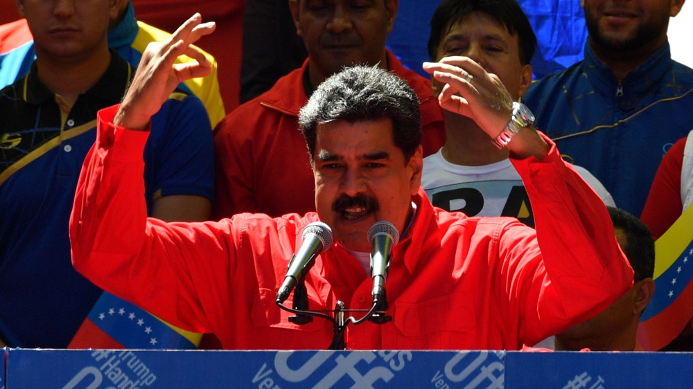 Venezuelan President Nicolas Maduro speaks during a pro-government march in Caracas [Yuri Cortez/AFP]