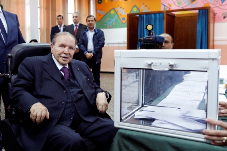 Algeria''s President Abdelaziz Bouteflika looks a journalists after casting his ballot during the parliamentary election in Algiers