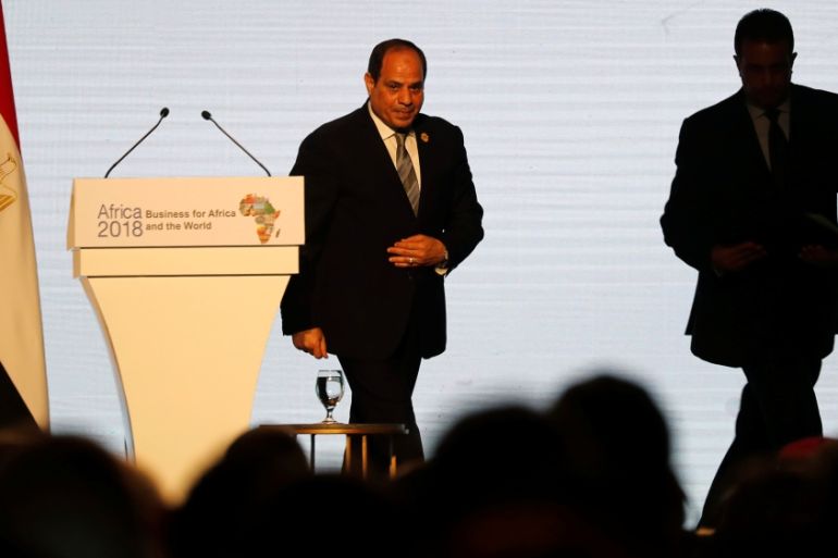 Egyptian President Abdel Fattah al-Sisi leaves the podium after speaking during Africa 2018 Forum at the Red Sea resort of Sharm el-Sheikh