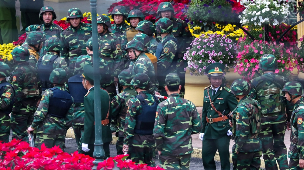 Vietnamese soldiers at the Dong Dang railway station where Kim is expected to arrive [Athit Perawongmetha/Reuters]