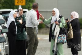 Members of a family react outside the mosque following a shooting at the Al Noor mosque in Christchurch, New Zealand, March 15, 2019