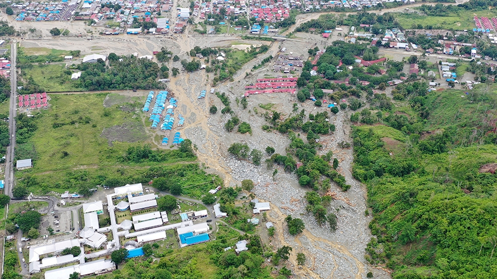 This aerial photo shows the area affected by flash floods in Sentani, Papua province [Barce Rumkabu/AP Photo]