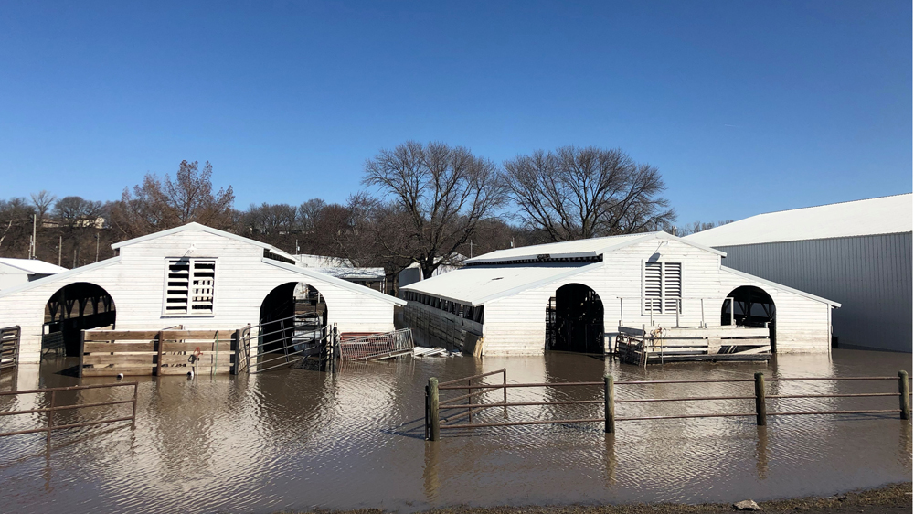 Paddocks at Washington County Fairgrounds are partially underwater due to flooding in Arlington, Nebraska [Humeyra Pamuk/Reuters]