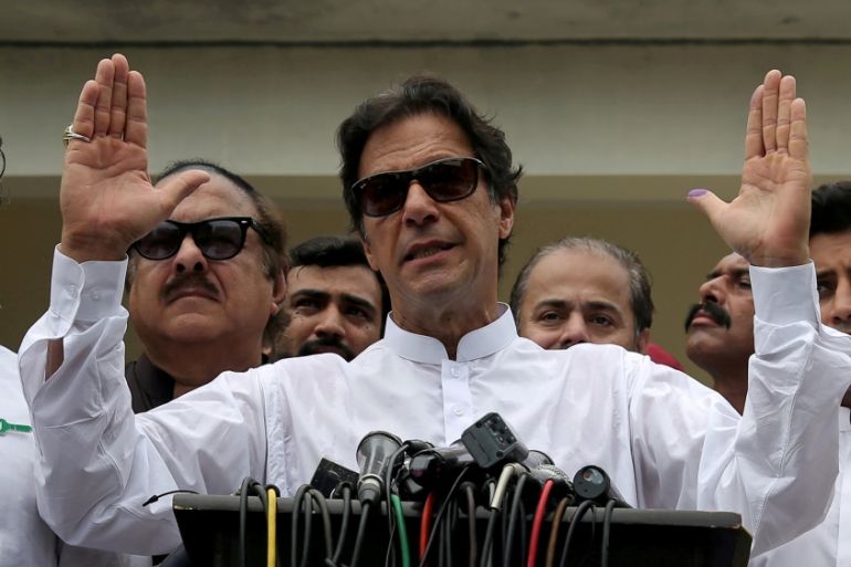 FILE PHOTO: Cricket star-turned-politician Imran Khan, chairman of Pakistan Tehreek-e-Insaf (PTI), speaks after voting in the general election in Islamabad