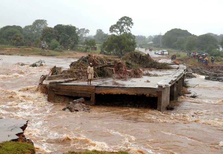 A man looks at a washed away bridge along Umvumvu river following Cyclone Idai in Chimanimani, Zimbabwe March 18, 2019. REUTERS/Philimon Bulawayo