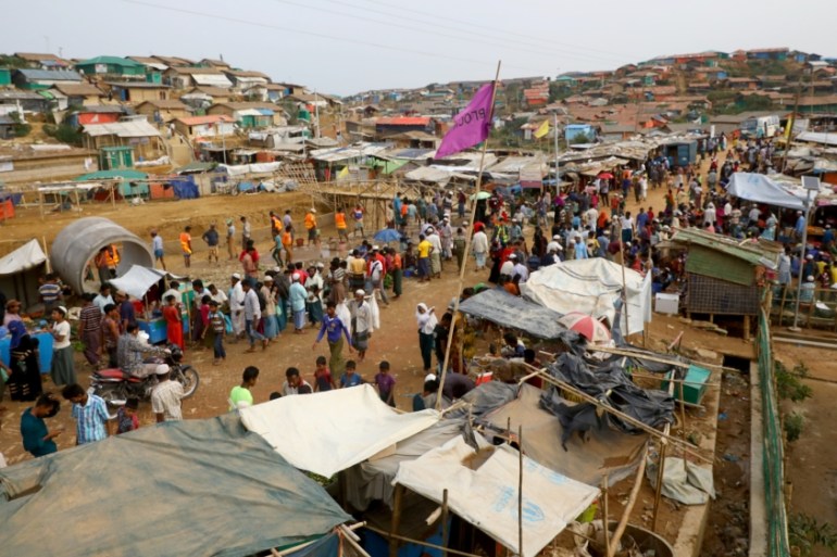 Rohingya refugees gather at a market inside a refugee camp in Cox''s Bazar