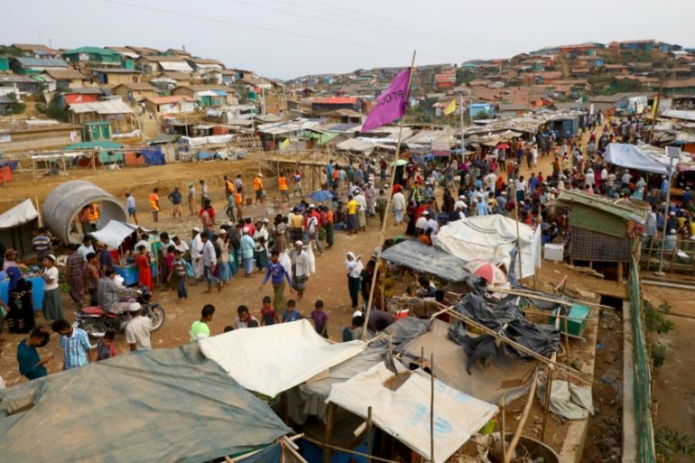Rohingya refugees gather at a market inside a refugee camp in Cox''s Bazar