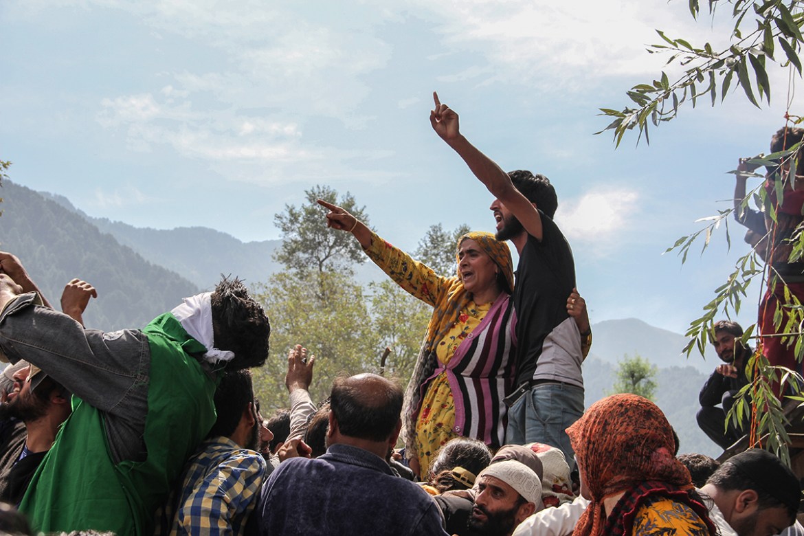 Mother of a local rebel, Asif Malik shouting slogans on his funeral in South Kashmir. [Sameer Mushtaq/Al Jazeera]