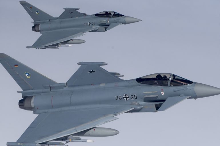 File -- In this Tuesday, April 25, 2017 photo German Eurofighter Typhoon fighter jets participate in NATO''s Baltic Air Policing Mission operate in Lithuanian airspace during an air force exercise. Bri