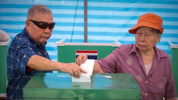 A Thai elderly couple cast their votes at a polling station during the general election on the outskirts of Bangkok, Thailand, 24 March 2019. More than 51 million Thais are eligible to cast their vot