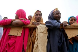 Women are seen waiting for the voting to start during Nigeria''s governorship and state assembly election in Karu