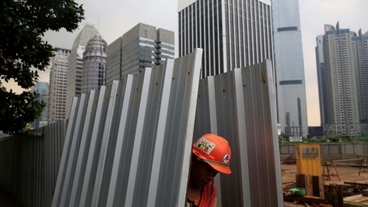 A worker of the Jakarta Mass Rapid Transit construction is pictured at a construction site at Sudirman Business District in Jakarta