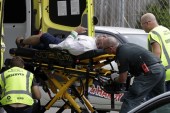 Ambulance staff take a man from outside a mosque in central Christchurch, New Zealand, March 15, 2019 [Mark Baker/AP]
