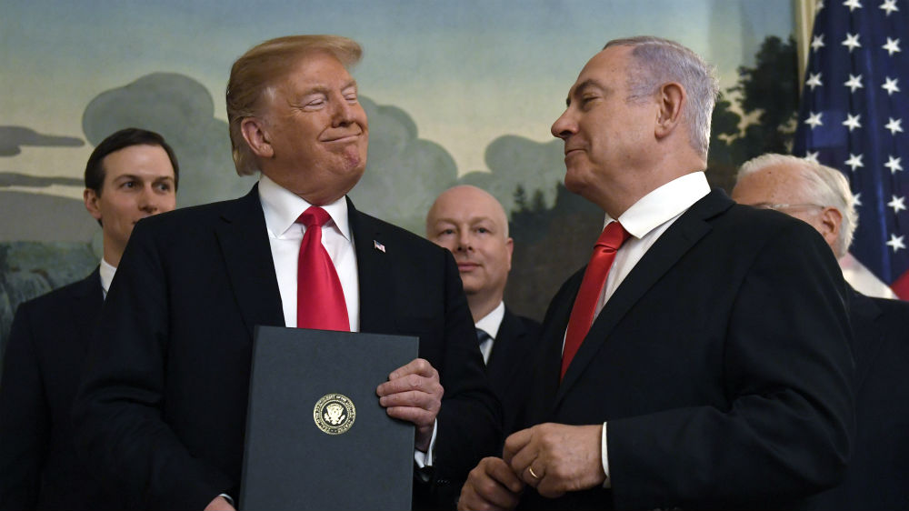 President Donald Trump smiles at Israeli Prime Minister Benjamin Netanyahu on Monday [Susan Walsh/AP]