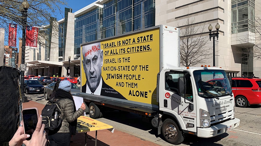 A few members of Jewish Voice for Peace held a protest on a street corner outside the AIPAC conference [William Roberts/Al Jazeera]