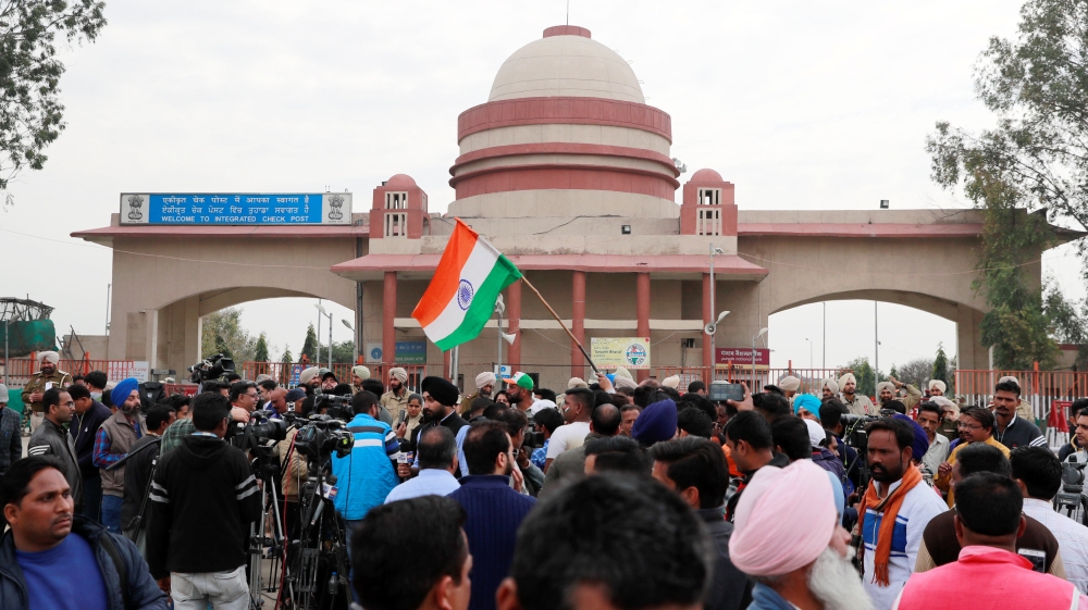 People and media gather before the arrival of an Indian air force pilot, who was captured by Pakistan on Wednesday, near Wagah border, on the outskirts of the northern Indian city of Amritsar [Danish Siddiqui/Reuters]