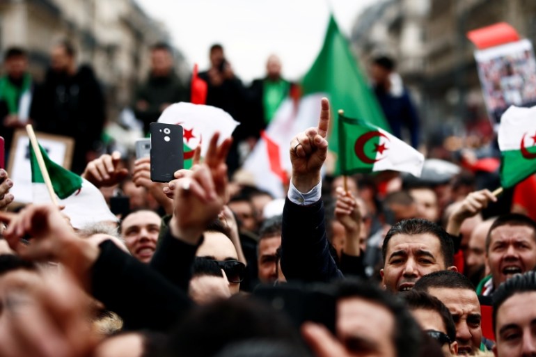 Demonstrators gather near the Monument to the Republic during a protest against Algerian President Abdelaziz Bouteflika seeking a fifth term in a presidential election in Paris