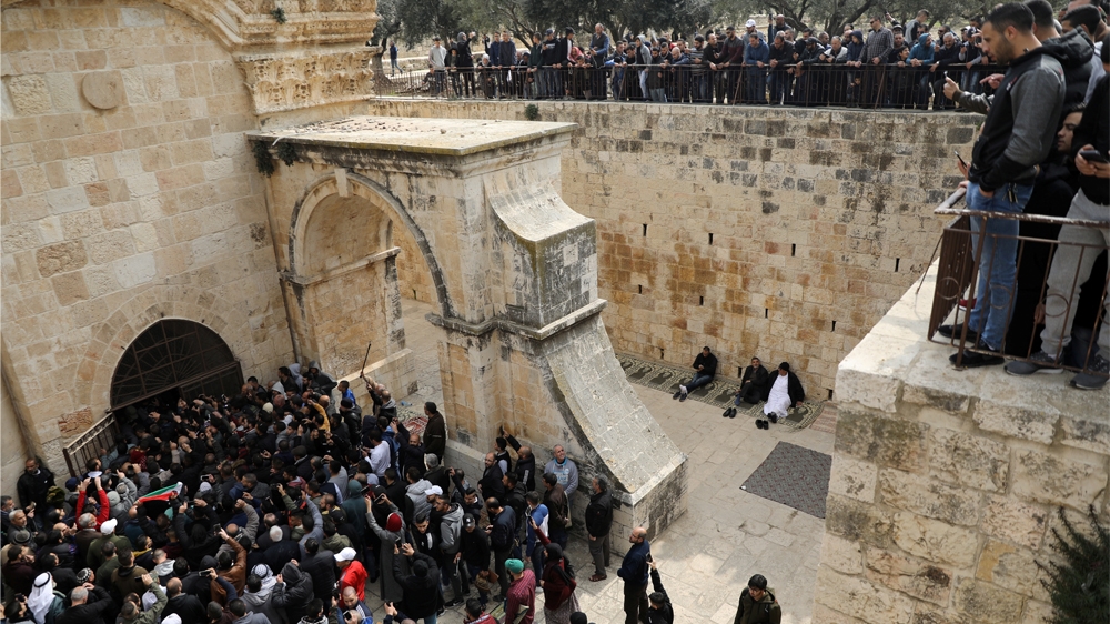 Palestinian Muslims enter Bab al-Rahma in the Al-Aqsa compound for the first time in 16 years [Ammar Awad/Reuters]