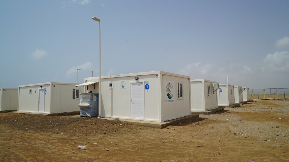 
Each air-conditioned residential unit includes a toilet, bedroom, living room and kitchen, along with cooking facilities [Faisal Edroos/Al Jazeera]
