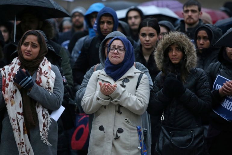 Muslims pray during a vigil for victims of the mosque shootings in New Zealand, outside city hall in Toronto