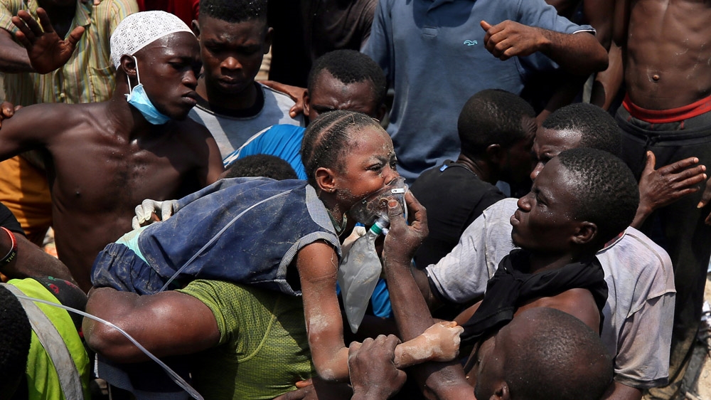 Dozens of people were pulled from the rubble and taken to hospitals [Afolabi Sotunde/Reuters]