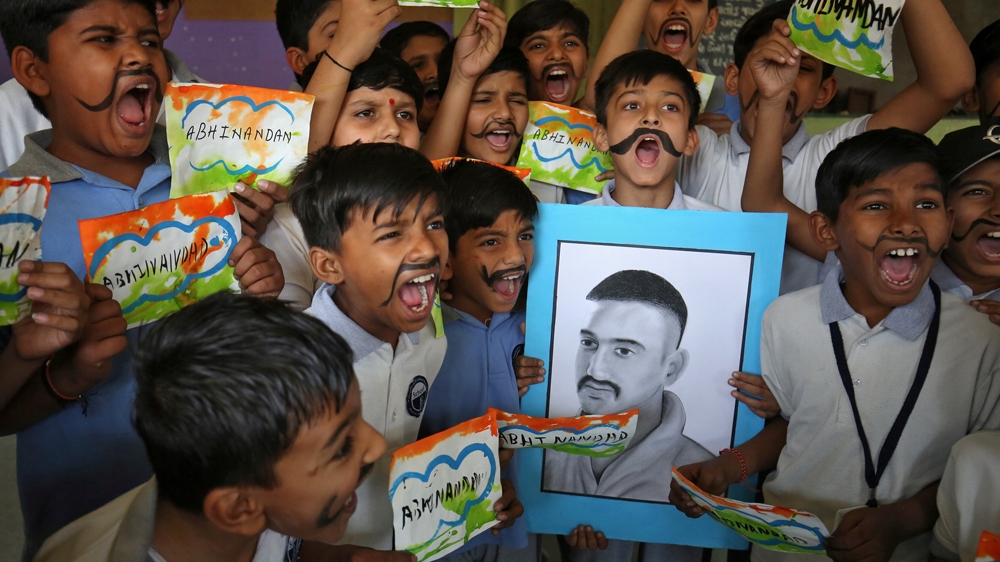 School children celebrate the release of Indian Air Force pilot Wing Commander Abhinandan Varthaman at a ceremony inside a school in Ahmedabad [Amit Dave/Reuters]