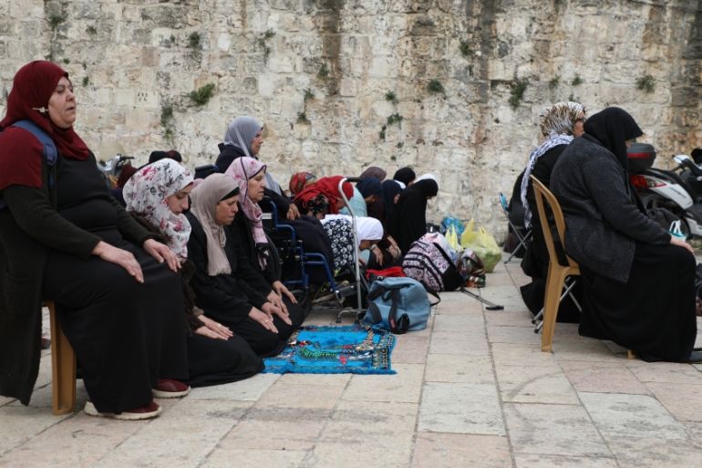 Palestinians perform prayer at Bab al-Asbat