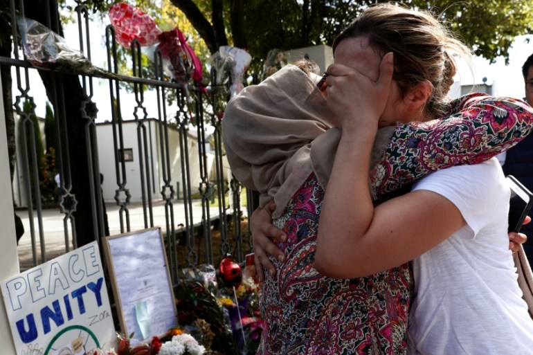 A woman cries next to a tribute to victim Hussein Al-Umari outside Al-Noor mosque after it was reopened in Christchurch, New Zealand, March 23, 2019