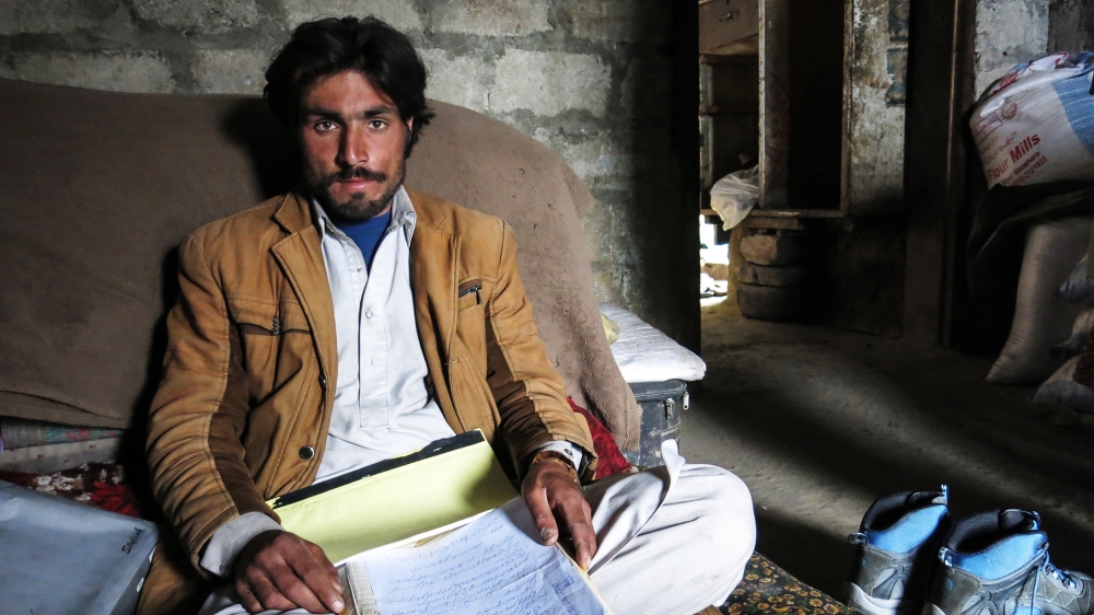 Afzal Kohistani's younger brother Gul Nazar, 28, who appeared in the 2012 video, has been living in hiding for years, and cannot even go to the bazaar to buy basic necessities out of fear for his life [Asad Hashim/Al Jazeera]