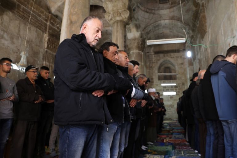 Palestinian Muslims pray inside the Golden Gate near Al-Aqsa mosque in Jerusalem''s Old City