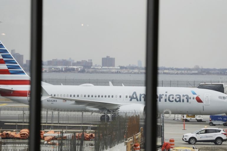 An American Airlines Boeing 737 MAX 8 plane sits at a boarding gate at LaGuardia Airport Wednesday, March 13, 2019, in New York.