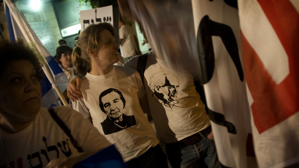 Israeli left-wing activists wear T-shirts with pictures of first Israeli Prime Minister David Ben-Gurion, right, and fourth Israeli Prime Minister Golda Meir as they participate in a rally against West Bank Jewish settlements, in Jerusalem on May 15, 2010 [Sebastian Scheiner/AP]