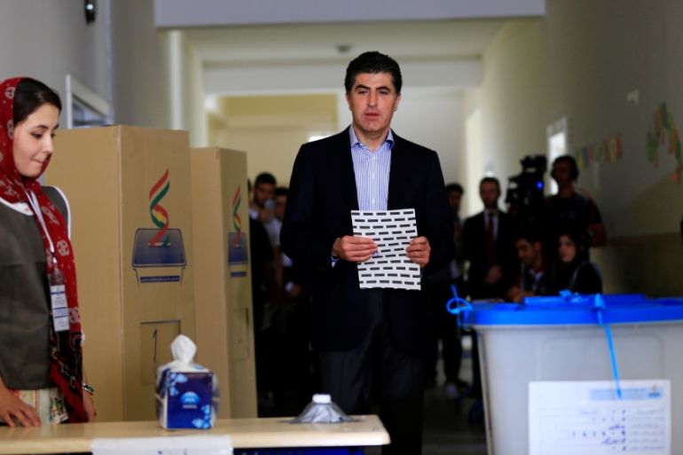 Kurdistan Regional Government Prime Minister Nechirvan Barzani prepares to cast his vote at a polling station during parliamentary elections in the semi-autonomous region in Erbil