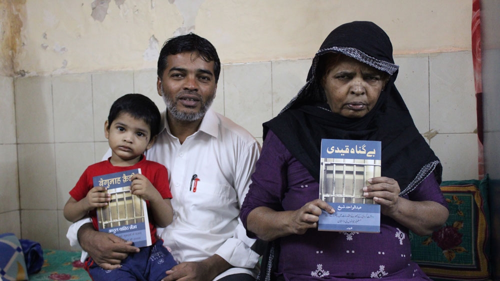 Sheikh's mother Sajida, right, said she prayed for her son's release [Bilal Kuchay/Al Jazeera]