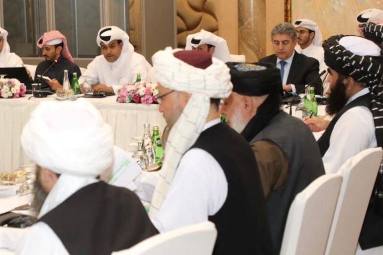 Taliban and Qatar officials during a meeting for peace talks in Doha, Qatar