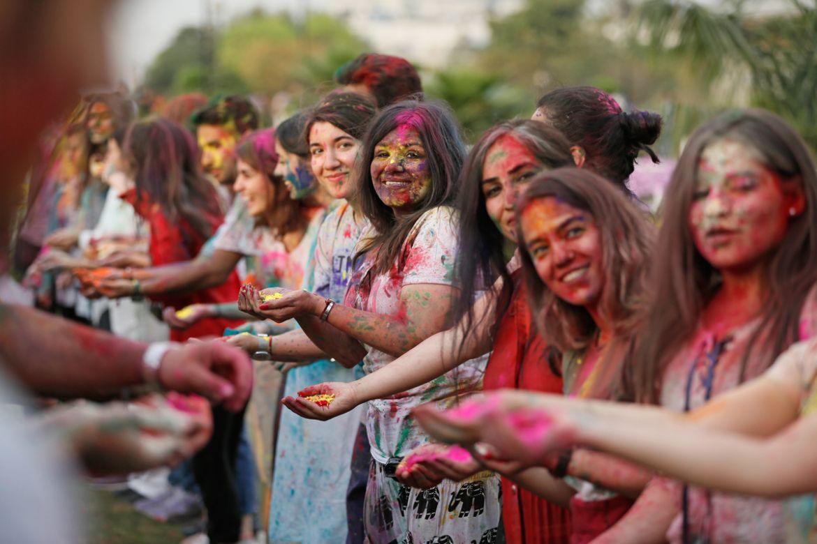A view of people celebrating Holi festival with colours at Central Park on March 20, 2019 in New Delhi, India. Holi Festival, also known as Spring Festival of Colors is observed in India at the end o