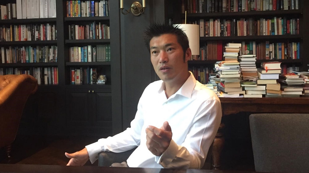 Thanathorn in his library at home where the idea of Future Forward was formed [Kate Mayberry/Al Jazeera]
