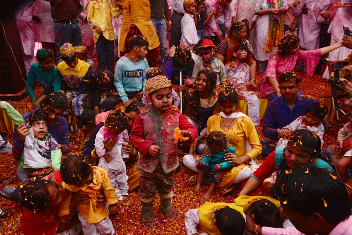 An Indian children who suffering from cerebral palsy take part in an event to celebrate the Hindu festival of Holi for children with cerebral palsy organized by the Trishla Foundation in Allahabad on