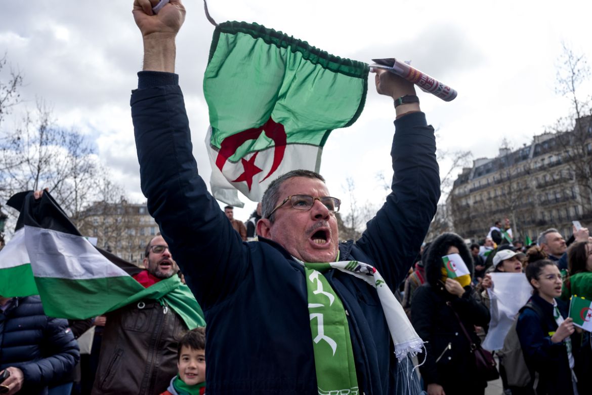 An Algerian protester shouts slogans during a demonstration against Algerian President Abdelaziz Bouteflika in Place de la RE`publique in Paris, France. Photo by Omar Havana