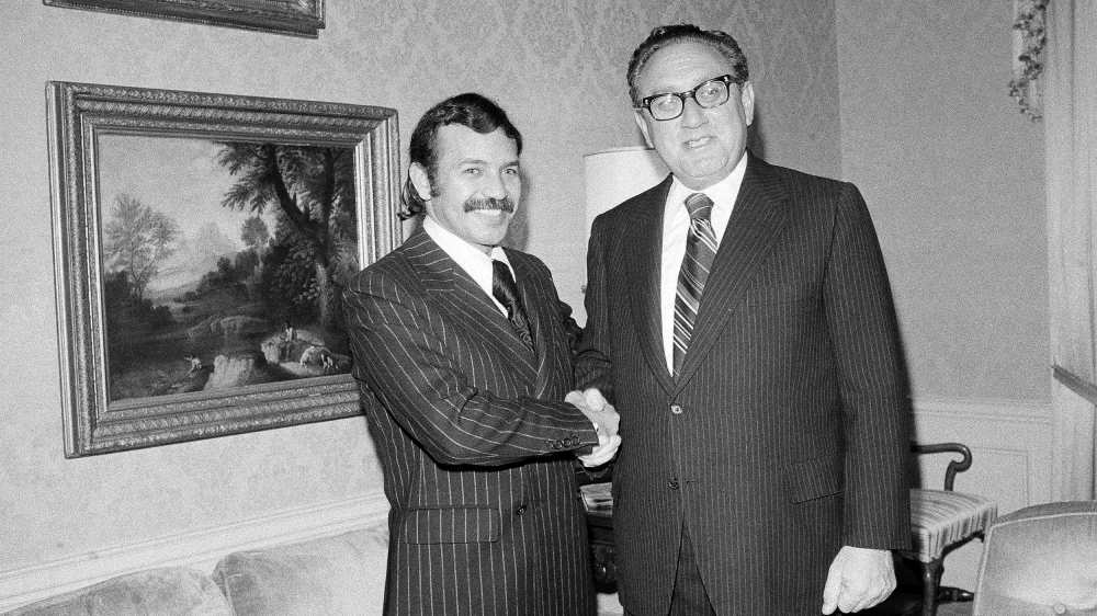 Abdelaziz Bouteflika with US Secretary of State Henry Kissinger in 1975 [Dave Pickoff/AP]