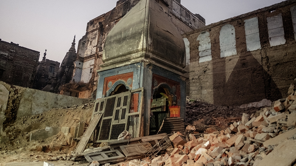 A Hindu temple amidst the debris of old buildings in the area of Pakka Mahal. Civil society groups and also Hindu clerics have protested against the government-driven demolitions [Andrea de Franciscis/Al Jazeera]