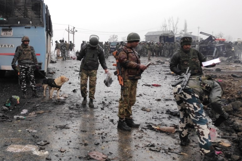 Indian soldiers examine the debris after an explosion in Lethpora in south Kashmir''s Pulwama district