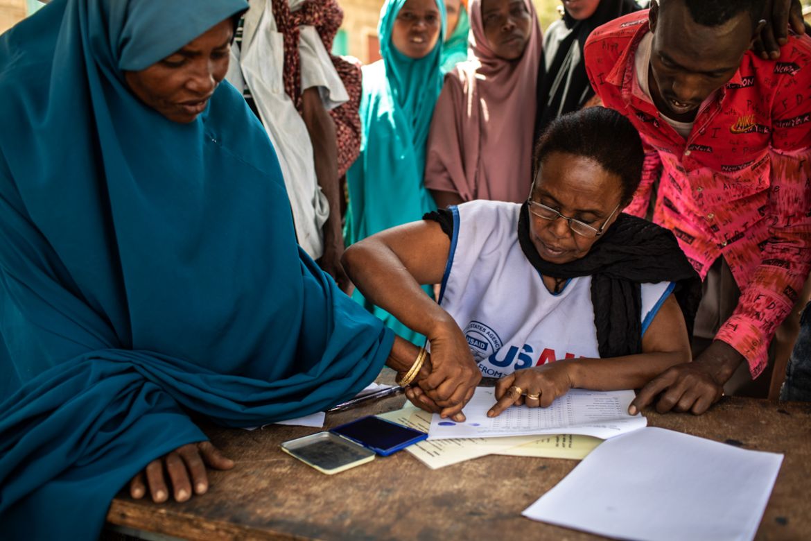People register during a USAID food distribution in Ejianeni, in rural Dire Dawa administration, Ethiopia, on February 10, 2019. A consortium of Non-Government Organizations led by Catholic Relief Ser