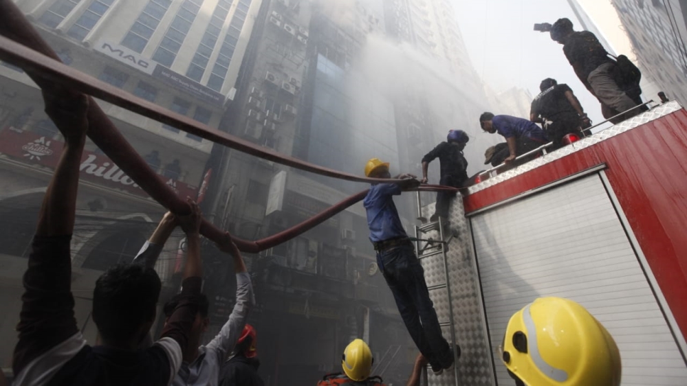 
Officials say six people died after jumping from the blazing building [Mahmud Hossain Opu/Al Jazeera]
