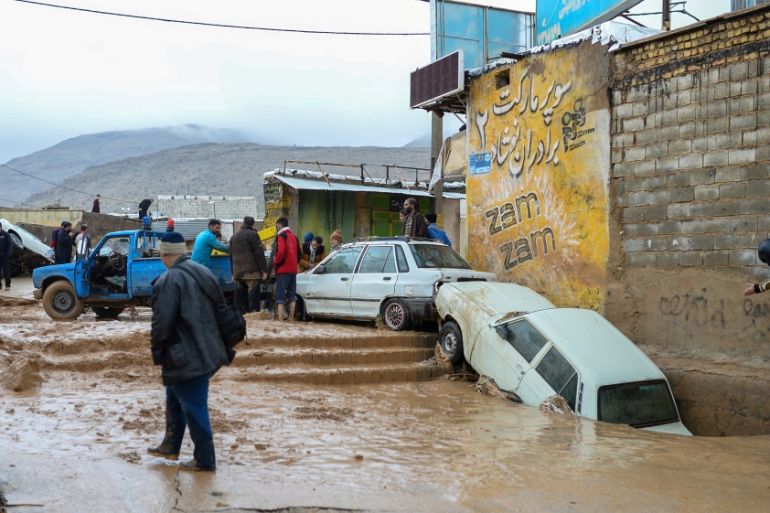 Damaged vehicles are seen after a flash flooding in Shiraz