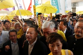 (L-R) Pro-democracy activists Lee Wing-tat, Chan Kin-man, Benny Tai, Chu Yiu-ming, Tanya Chan and Shiu Ka-chun arrive at the court for sentencing on their involvement in the Occupy Central, also known