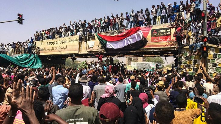 Protesters rally at a demonstration near the military headquarters, Tuesday, April 9, 2019, in the capital Khartoum, Sudan. Activists behind anti-government protests in Sudan say security forces have