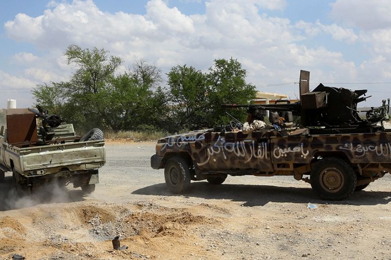 Fighters loyal to Libya''s Government of National Accord (GNA) hold a position west of the city of Aziziah, some 60 kilometres southwest of the capital Tripoli, on April 14, 2019. - Fighting near Tripo